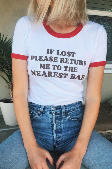 If lost please return me to the nearest bar tee